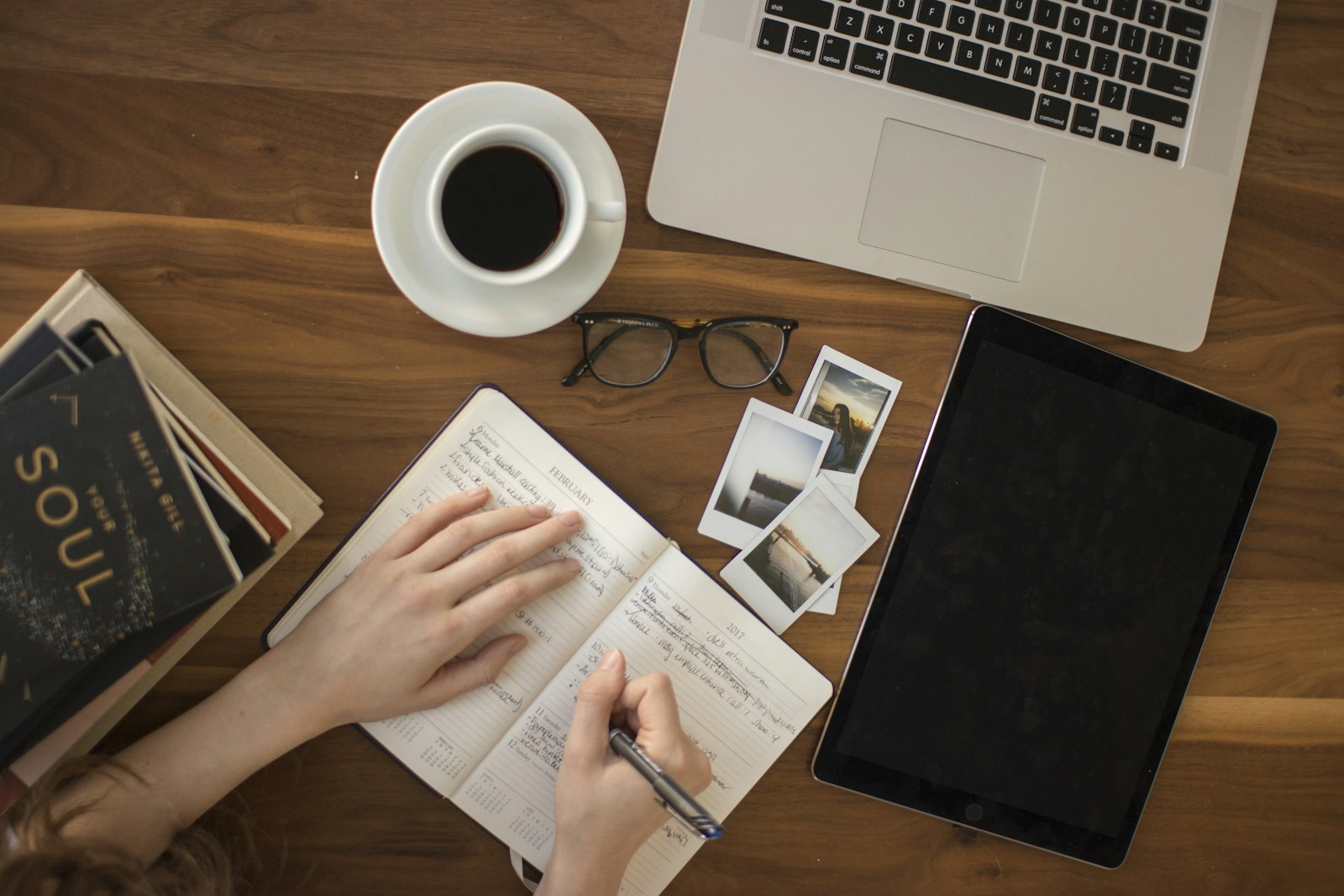 A writer's workspace with laptop and notes